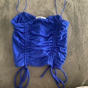 Spaghetti strapped crop tank, size medium, it’s a dark blue color.